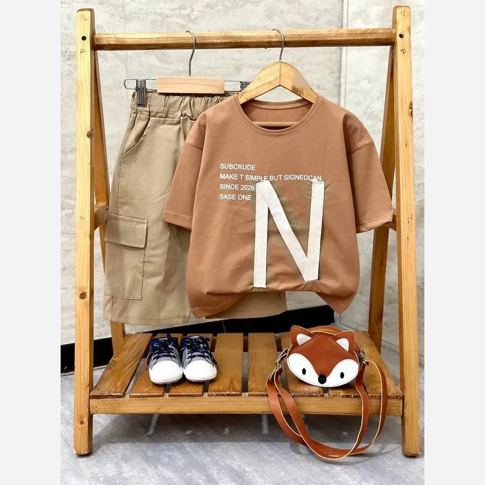 ست خوشگل پسرانه N تیشرت پنبه درجه یک و شلوارک کتان مشکی نسکافه ای سایزبندی 40 تا 60